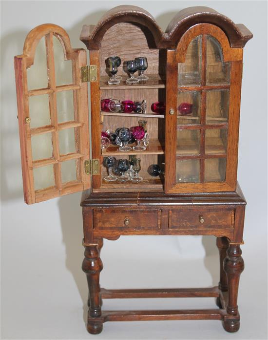 A Fergus Lane miniature Queen Anne style double dome top bookcase, 9in.